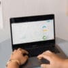 Man analyzing marketing performance data and website analytics on a laptop.